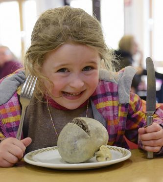 Sarah Burton from Spean Bridge, tries out her award winning haggis.