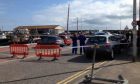 Police at Arbroath Harbour after the discovery of the body. Picture courtesy of The Courier