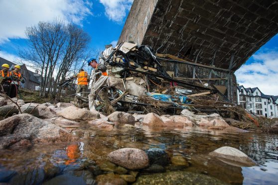 Troops got to work removing debris from the arches of Ballater's Royal Bridge