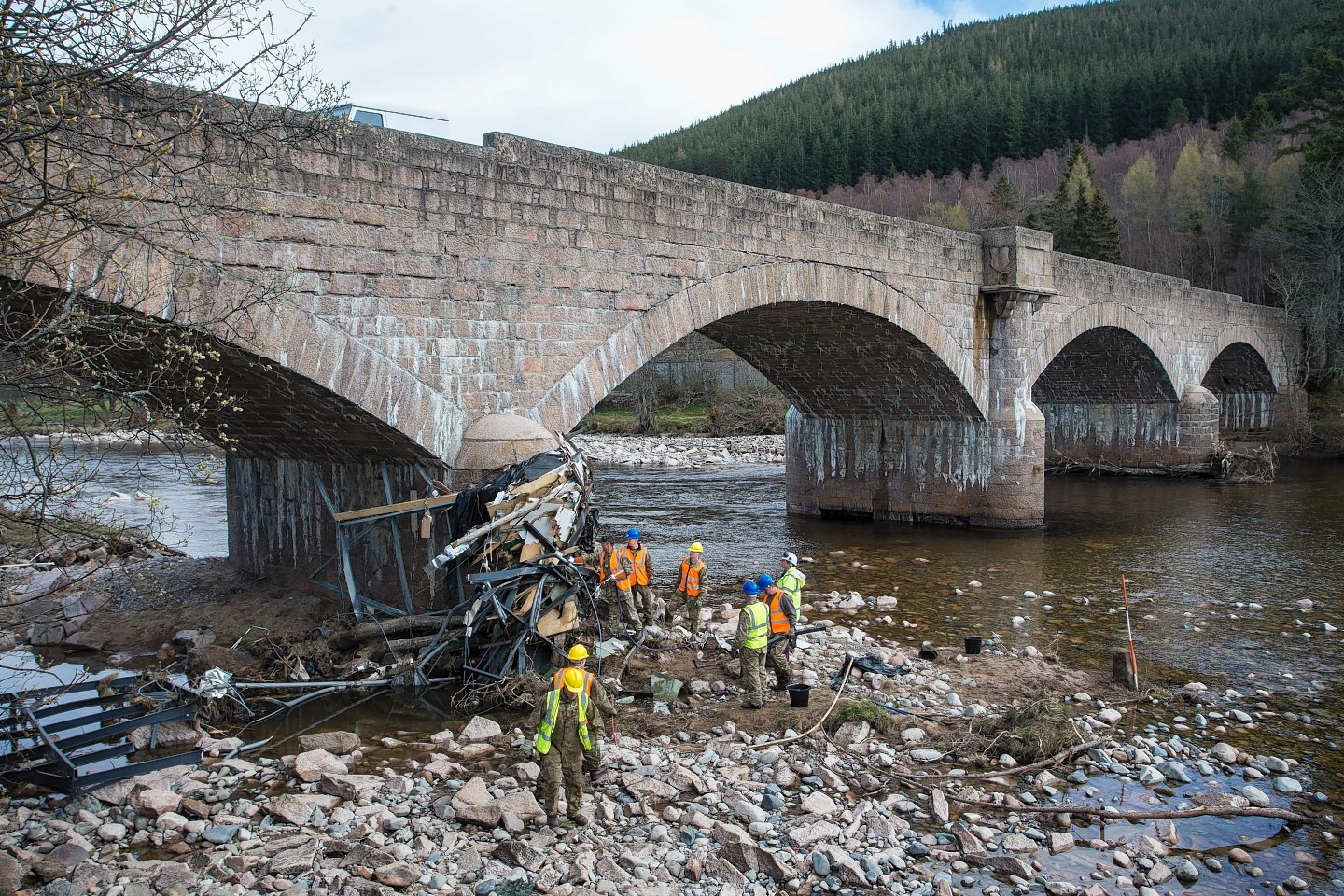 Troops got to work removing debris from the arches of Ballater's Royal Bridge