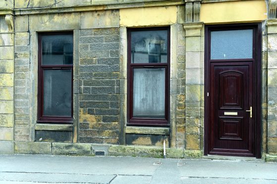 The front of the flat in Low Street, Buckie which was damaged by fire. 
Picture by Gordon Lennox