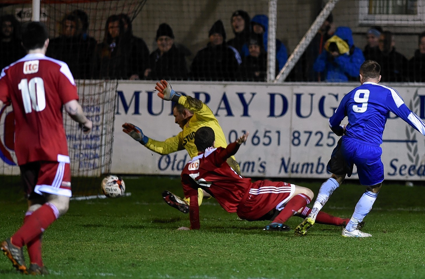 Cove striker Daryl Nicol scores the only goal of the game