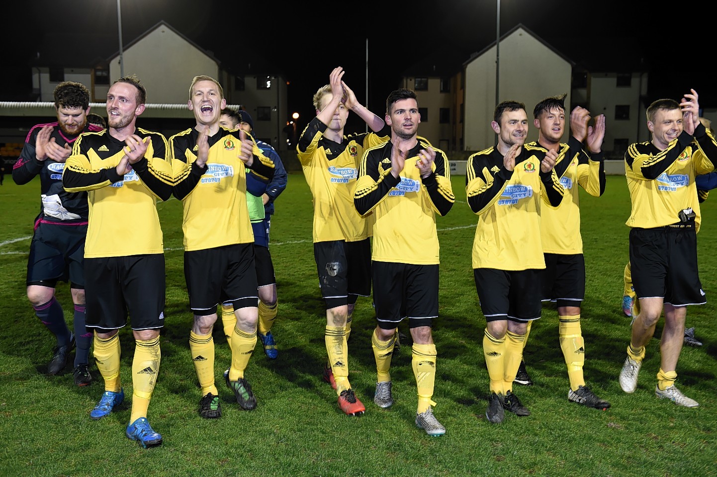 Cove players celebrate after securing the Highland League title. Picture by Kenny Elrick