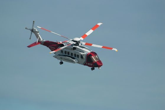 The coastguard helicopter during the search above Cruden Bay
