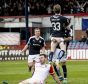 Craig Wighton celebrates after scoring Dundee's fourth goal beside a dejected Paul Quinn