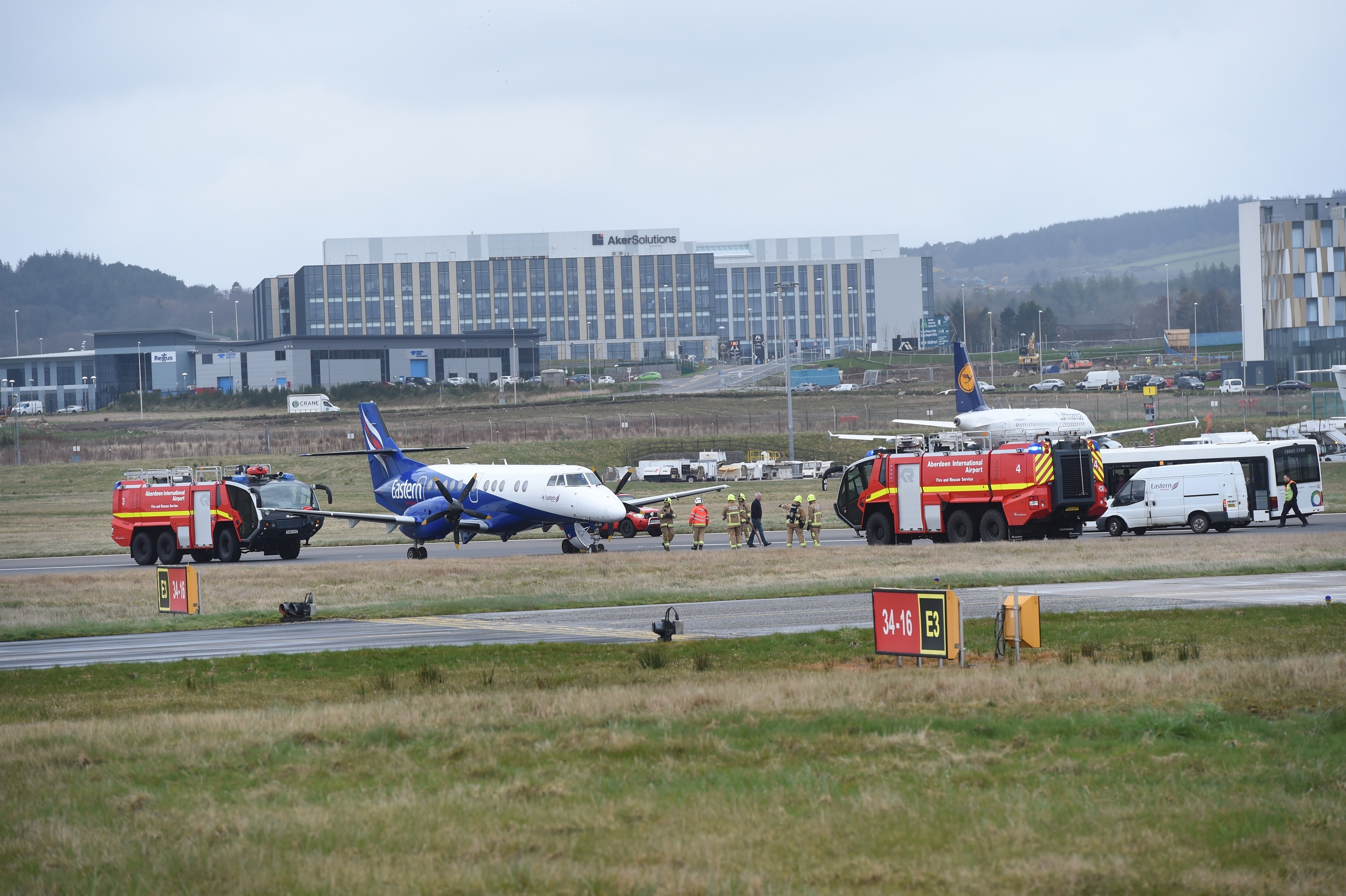 Emergency services alongside the plane at Aberdeen Airport