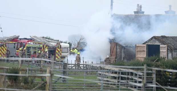 Firefighters at the scene of the blaze at a farm near Invergordon