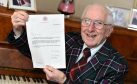Jack Sinclair with his letter from Buckingham Palace. Picture by Kevin Emslie