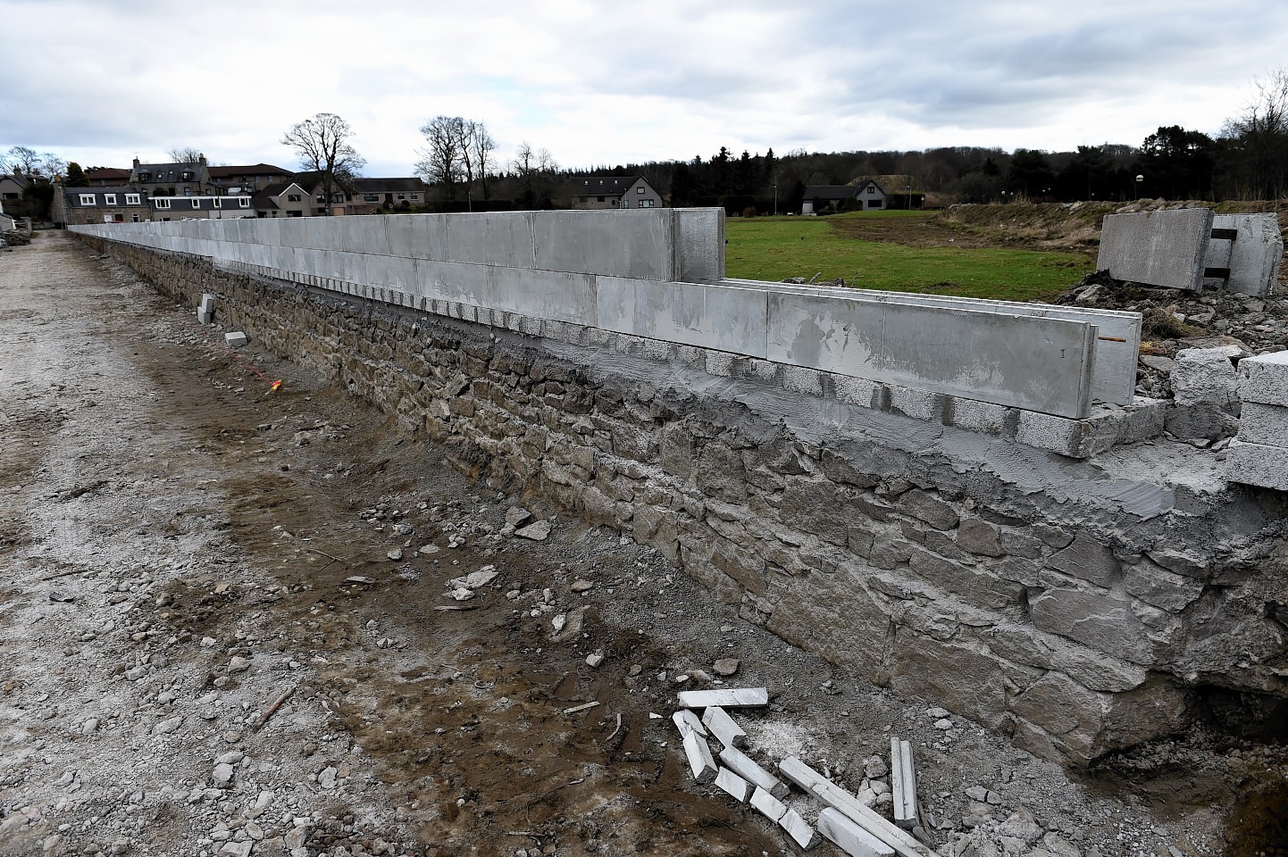 The firm is building a flood defence behind their business to help protect against future flooding.