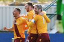 Motherwell's Lionel Ainsworth celebrates with his team-mates.