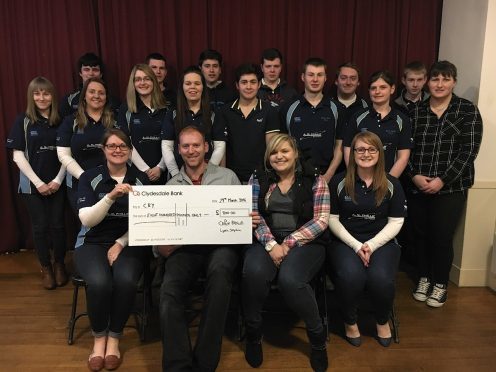 New Deer Young Farmers' Club members donating a cheque to Cardiac Risk in the Young