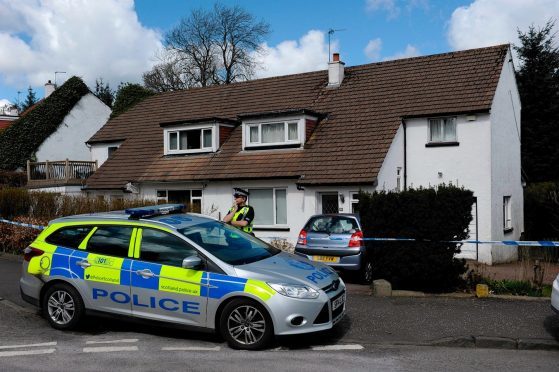 Police on the scene of the house where Xin Xin Liu was found