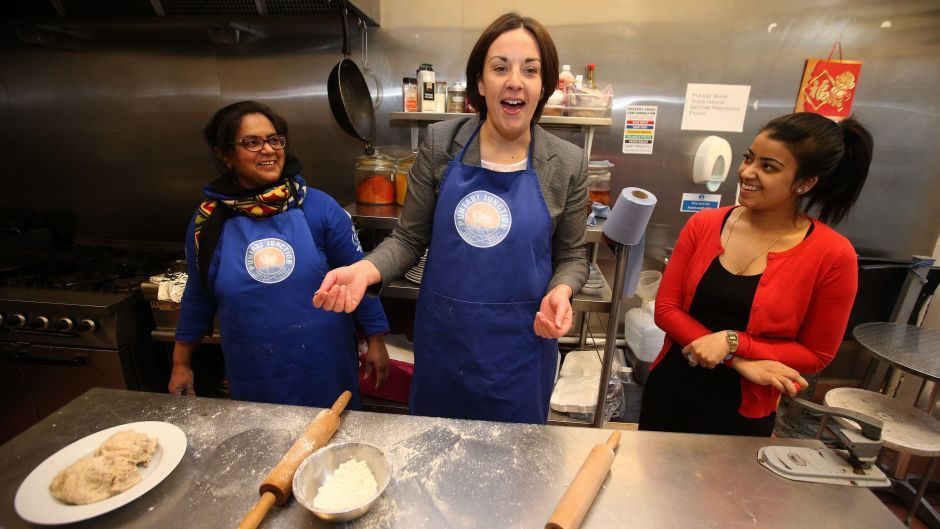 Kezia Dugdale (centre) with chef Shahana Anwar (left) and manager Sinita Potiwal (right) making chapatis during a visit to Punjabi Junction cafe in Edinburgh