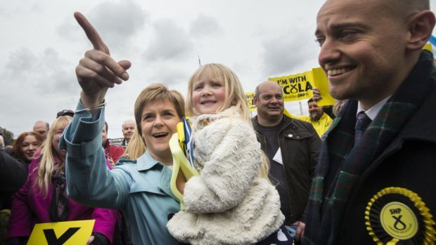 Nicola Sturgeon holds five-year-old Holly Baird on the campaign trail in South Queensferry