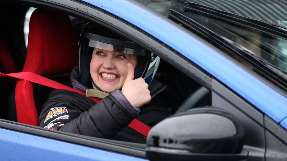 Scottish Conservative leader Ruth Davidson sits in a blue car at Knockhill racing circuit near Dunfermline in Scotland, while on the her election campaign trail. She drove around the track racing a red car.