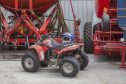 The quadbike with the helmet containing the Robin's nest in the workshop and machinery store at Thura Farm, Bower.