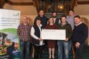 Members of the Montrose Farmers' Ball committee handing over a cheque to RSABI