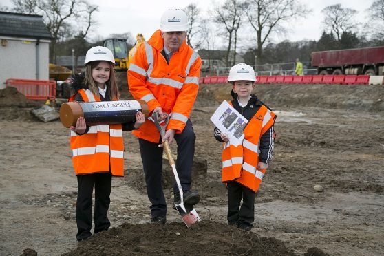 John McHardy, development officer at Robertson Eastern, breaks ground at Greenbrae Primary School.