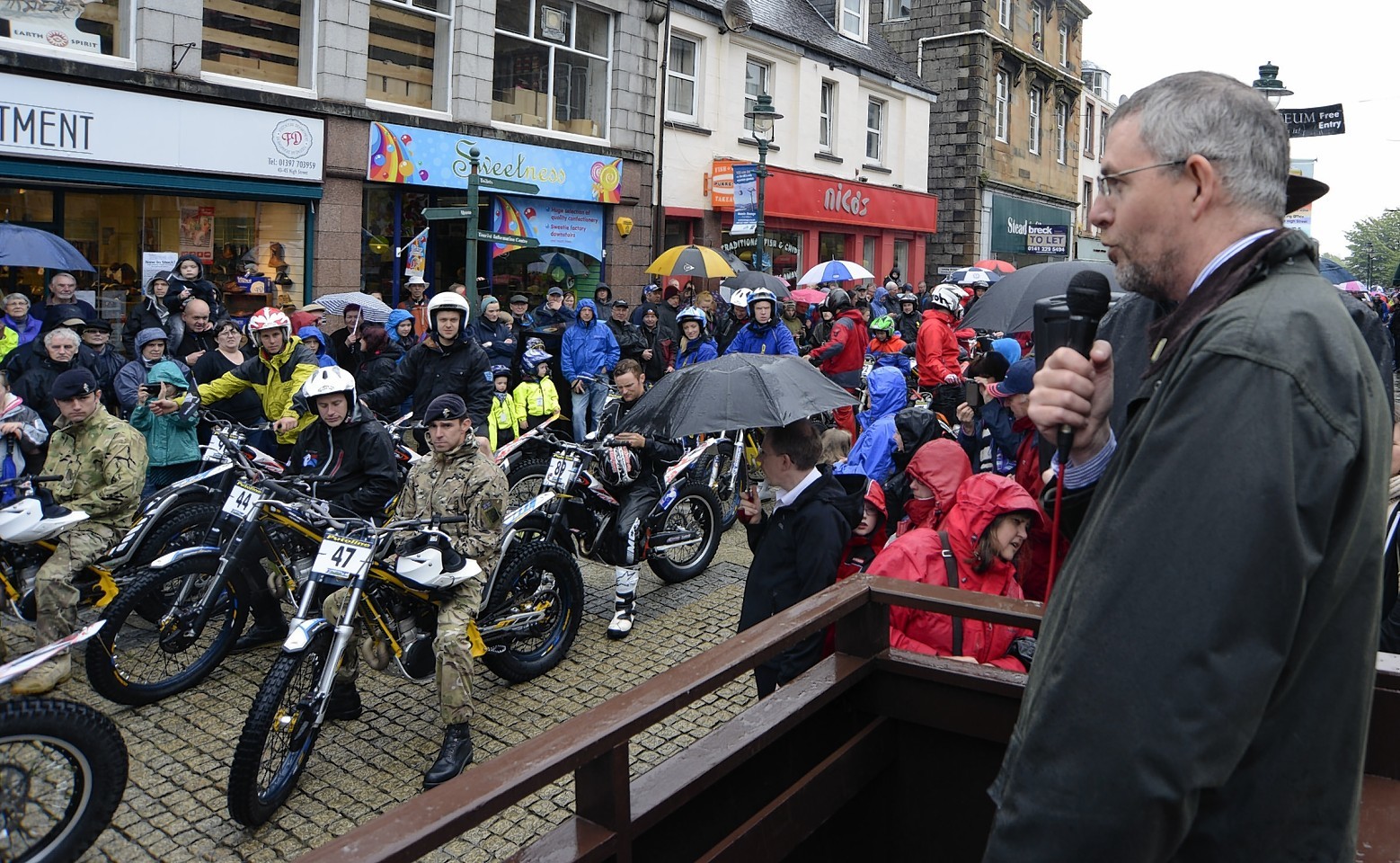 Councillor Thomas MacLennan welcomes riders at the start of a previous Scottish Six Days Trial in Fort William High Street
