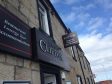 Thieves stole a safe containing about £5000 from the Clifton Hotel in Lossiemouth.