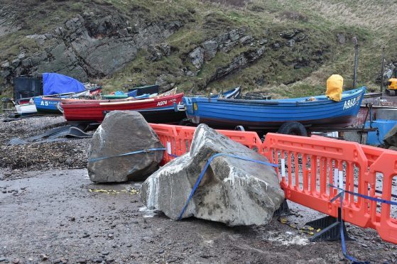 Large boulders and smaller stones arrive at Cove  Harbour to prevent access.