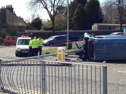 A taxi driver had a lucky escape after a lamppost crashed through the front of his car.