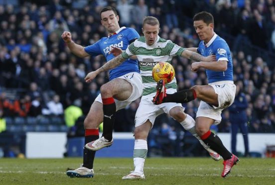 Celtic forward Leigh Griffiths goes up against Rangers duo Lee Wallace and Ian Black when the teams met last season