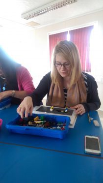 New Elgin Primary School acting Depute Headteacher Jen Spencer gets to grips with Lego training.
