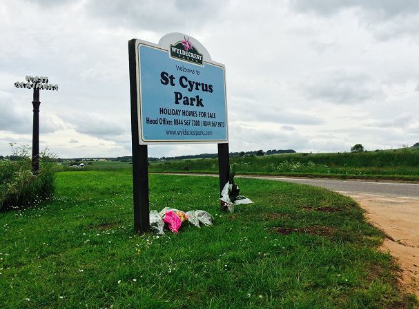 Floral tributes were laid at St Cyrus Park, close to where Eoin MacDonald died in a fatal crash last year.