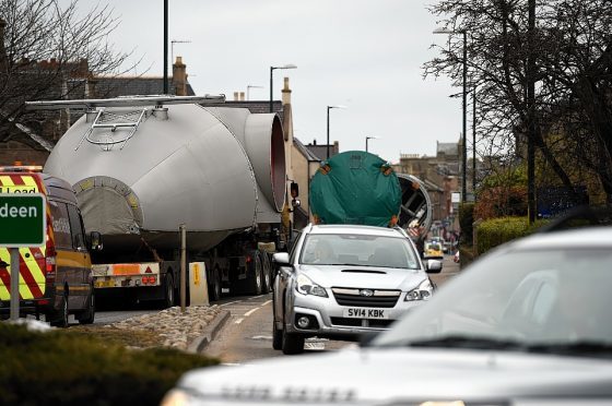 Oversize loads of wind turbine components as they are transported along the A96 through Elgin.