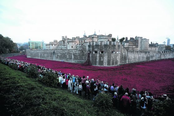 Poppies: Weeping Window is from the installation Blood Swept Lands and Seas of Red – poppies and original concept by artist Paul Cummins and installation designed by Tom Piper – by Paul Cummins Ceramics in conjunction with Historic Royal Palaces. The installation was originally at the Tower of London in 2014.