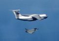 Russian IL76 Candid aircraft, being shadowed by a RAF Typhoon (bottom).