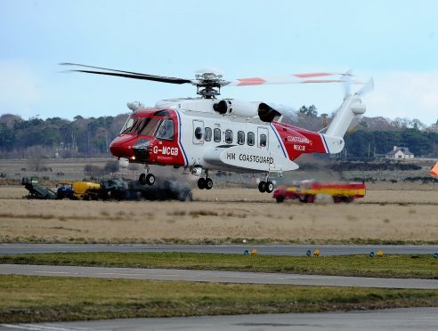 A Bristows search and rescue helicopter goes through its paces at the Inverness search and rescue base.