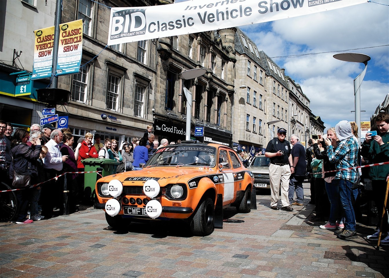 Crowds gather to see off the vehicles at the show.