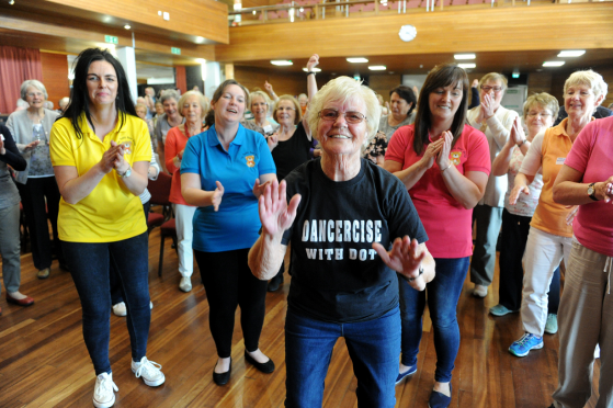 Dot Bremner, centre, who raised £2275, with her dancercise classes, for the Teddy Bear Developmental Playgroup at Buckie, represented by, Angela Hay, left, Deborah Jennings, second left, and Pauline Riddoch, right. Picture by Gordon Lennox 27/05/2016