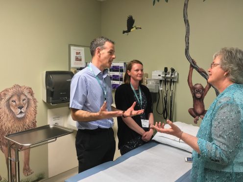 Dr Steve Turner and Senior Charge Nurse Lindsay Cameron discussing patient care in the oncology unit in Children's Hospital Dartmouth-Hitchcock with Sharon Brown from CHaD.