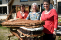 Karen Collins, Kate Clark, and Jane Duncan Rogers with the willow coffin that was on display in the St Giles Centre, Elgin as part of their Dying Awareness campaign.