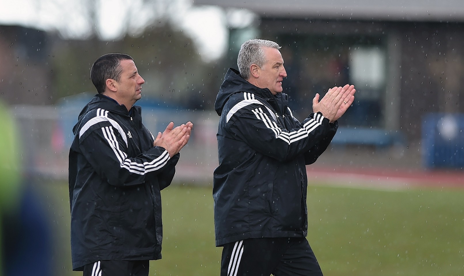 Manager John Sheran applauds the Cove fans at full time on Saturday