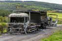 One of the burnt out lorries on the A97