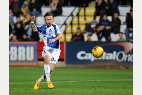 Matty Taylor fires a shot goalwards for Bristol Rovers