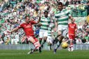 Niall McGinn pulls a goal back for the Dons against Celtic on Sunday