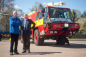 Morayvia in Kinloss has received a Highlander RIV Airport Fire Engine from Highlands and Islands Airports, represented by Grenville Johnston OBE, (right). Morayvia Director, Bob Dennett (left).