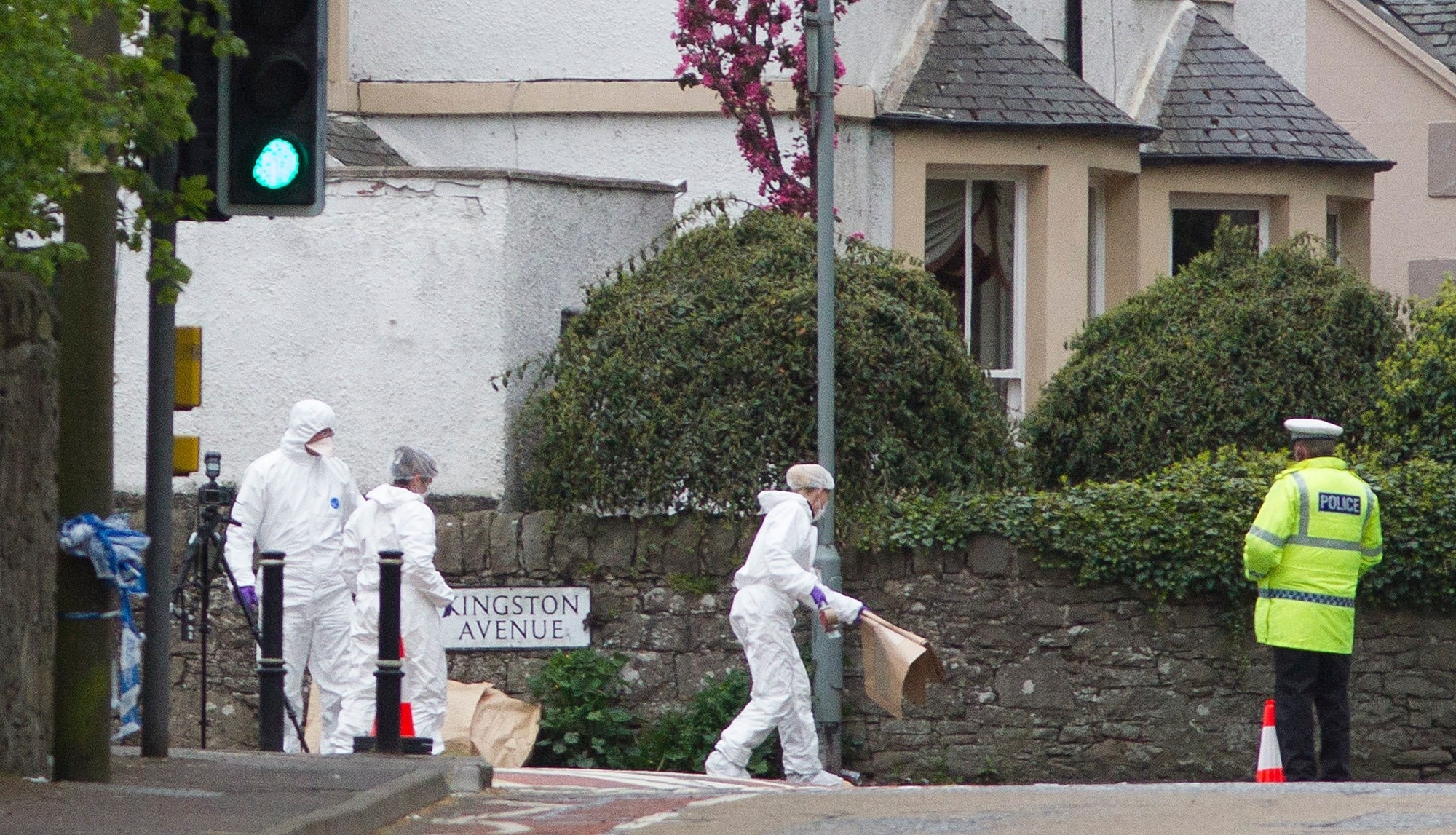 Forensic experts at the scene on Old Dalkeith Road, Edinburgh.