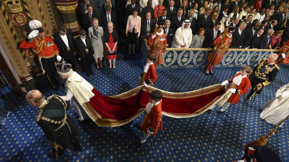 The Queen and Duke of Edinburgh proceed through the Royal Gallery