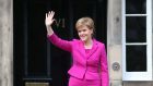 Scottish First Minister and SNP leader Nicola Sturgeon waves from the steps of Bute House in Edinburgh