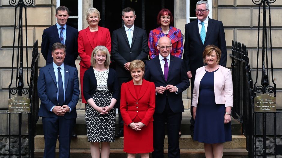 First Minister Nicola Sturgeon stands in front of her new Scottish Cabinet