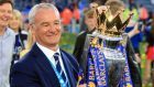 Leicester manager Claudio Ranieri proudly holds the Premier League trophy