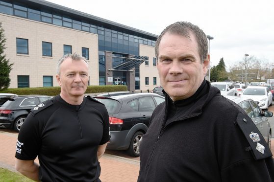 outgoing commander Chief Superintendent Julian Innes (left) with new Chief Superintendent Philip McRae (right)