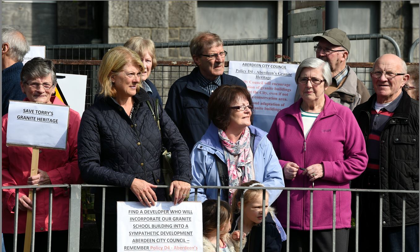 The local community have protested against plans to bring down the school building