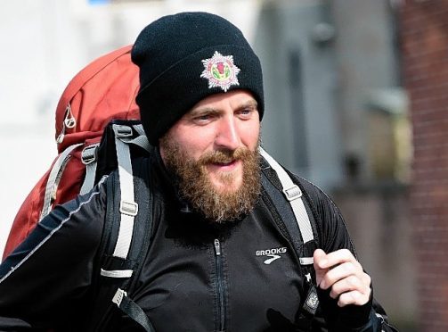 Wayne Russell is running the entire coast of Britain for charity.